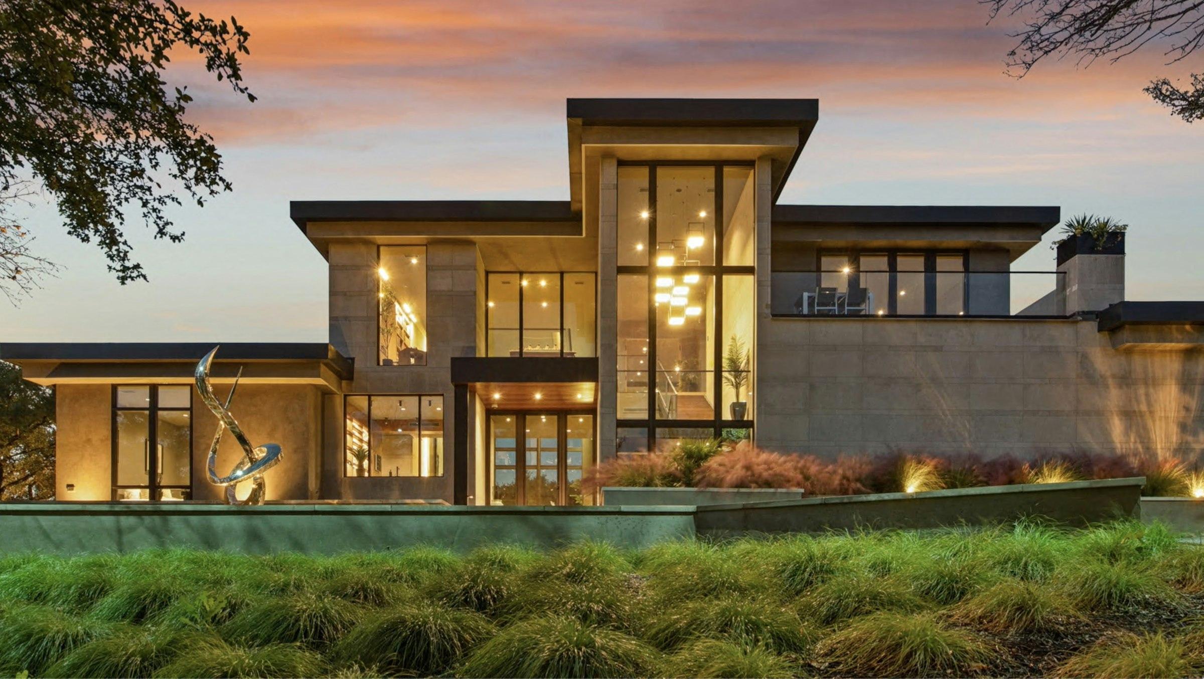 Contemporary luxury home exterior at dusk
