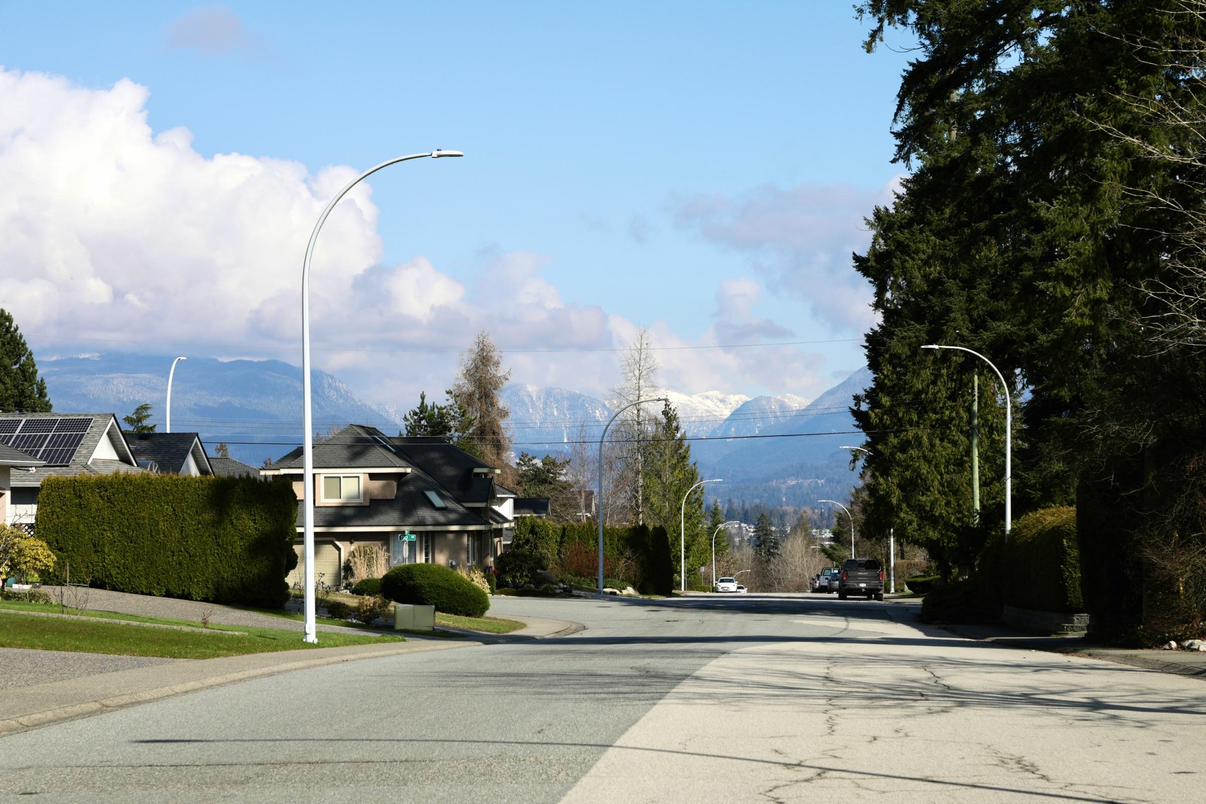 Suburban street with mountains in the background
