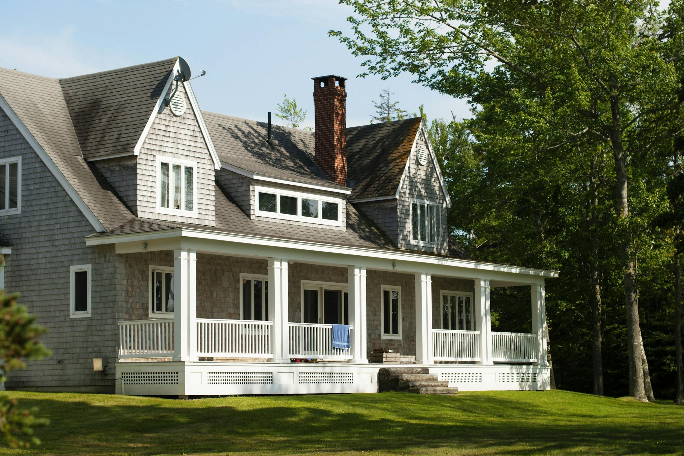 Traditional single-family home exterior with a wraparound porch
